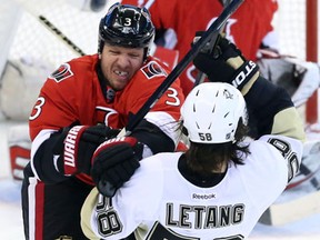 Ottawa's Marc Methot, left, checks Pittsburgh's Kris Letang during the first period of Game 4 Sunday. (THE CANADIAN PRESS/Fred Chartrand)