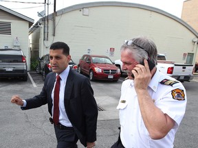 Windsor Mayor Eddie Francis and Windsor Fire Services Chief Fire Prevention Officer Lee Tome leave Emergency Command Centre and head toward a press conference at Main Branch of Windsor Public Library Tuesday May 21, 2013. (NICK BRANCACCIO/The Windsor Star)