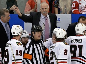 Chicago Blackhawks head coach Joel Quenneville of Riverside yells at referee Brad Watson during the third period of Game 3 of the Western Conference semifinal. (AP Photo/Paul Sancya)