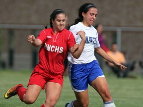 Holy Names' Kristen Melo, left, battles St. Anne's Guilia Barile in high school soccer playoff action at McHugh Park. (NICK BRANCACCIO/The Windsor Star)