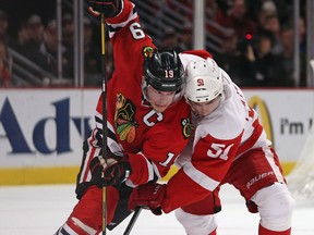 Chicago's Jonathan Toews, left, is checked by Detroit's Valtteri Filppula in Game 5 of the Western Conference semifinal.(Photo by Jonathan Daniel/Getty Images)