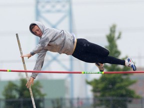 Herman's Devan Primeau  competes in the SWOSSAA senior boys pole vault competition at the University of Windsor Monday. (JASON KRYK/The Windsor Star)