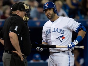 Toronto's Jose Bautista, right, talks with home plate umpire Bruce Dreckman after striking out against the Boston Red Sox. (THE CANADIAN PRESS/Nathan Denette)