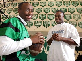 Herman's Chris Rwabukamba, left, signed a letter of intent to play football at Duke in 2006. Also in the photo is former Green Griffin O.J. Atogwe. (NICK BRANCACCIO/The Windsor Star)