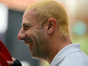 IndyCar driver Tony Kanaan shows off his new blond hair style during the Chevrolet Detroit Belle Isle Grand Prix media lunch at the Rattlesnake Club Thursday. (AP Photo/Detroit Free Press, Andre J. Jackson)