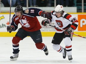 Mickey Renaud, left, battles with Ottawa's Tye McGinn during first-period action in 2008. (JASON KRYK/The Windsor Star)