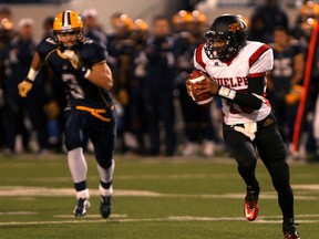 Windsor's Matt McGarva, left, chases Guelph's Jazz Lindsey. (KRISTIE PEARCE/The Windsor Star)