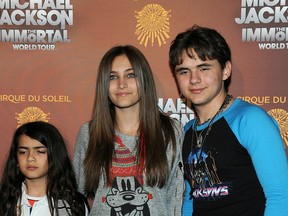 Michael Jackson's children are Prince Michael "Blanket," left, Paris and Prince Jackson arrive at the Michael Jackson The Immortal World Tour in Los Angeles on January 27, 2012.  (/AFP/Getty Images files)