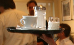 A server brings cream and sugar to a table. (Windsor Star files)