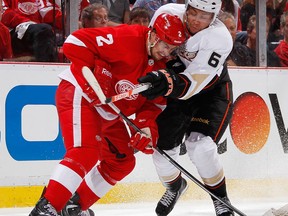 Detroit's Brendan Smith, left, is checked by Anaheim's Emerson Etem  Monday. (Photo by Gregory Shamus/Getty Images)