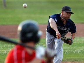 Windsor Stars pitcher Brad Boussey, right, throws a pitch against the Windsor Selects at Cullen Field. (NICK BRANCACCIO/The Windsor Star)