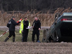 SIU members study the scene of a fatal accident on Manning Road on Apr. 18, 2013. (Nick Brancaccio / The Windsor Star)
