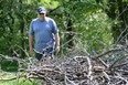 Ron Donaldson is shown in the Edward Tranby Park, Wedneday, May 15, 2013, in Windsor, Ont. He does maintenance there and has been complaining for years now about a pile of debris in the park.  (DAN JANISSE/The Windsor Star)