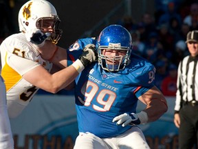 Windsor's Michael Atkinson, right, a graduate of Boise State, is working toward a career in the NFL. (Photo by John Kelly)