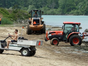 City workers prepare Sandpoint Beach for visitors on May 31, 2013. (Tyler Brownbridge / The Windsor Star)