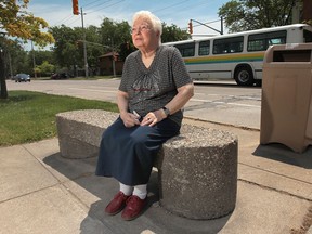 Mary Kamen, 78, a Sunset Ave. resident sits a former bus stop at the intersection of Sunset and University Ave West. Kamen has been using the stop for the past 66 years and is upset that Transit Windsor will no longer use it as a stop. (DAN JANISSE/The Windsor Star)