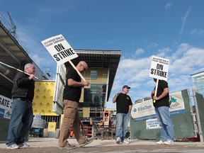International union of elevator constructors members walk the picket line in front of the Aquatic Centre construction site in downtown Windsor, Ont. Wednesday, May 8, 2013. (DAN JANISSE/The Windsor Star)