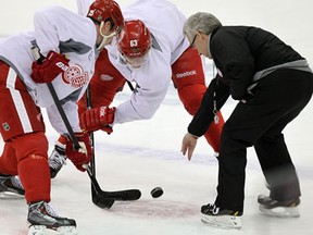 The Detroit Red Wings Cory Emmerton (left) and Joakim Andersson practice faceoffs during a team practice at the Joe Louis Arena in Detroit on Friday, May 17, 2013.                        (TYLER BROWNBRIDGE/The Windsor Star)