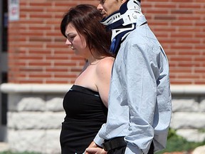 Angie and Andrew Williams at the June 21, 2012 funeral of their two daughters who were killed when the minivan they were riding in was struck by a train.  (The Windsor Star / TYLER BROWNBRIDGE)