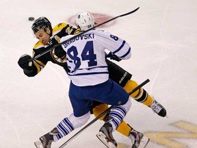 Toronto's Mikhail Grabovski, front, collides with Boston's Chris Kelly (23) during Game 7 of the Eastern Conference Quarter-finals May 13, 2013 at TD Garden in Boston. (AP Photo/Charles Krupa)