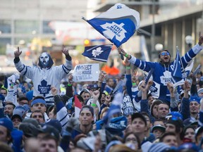 Toronto Maple Leafs fans react as they watch Game 7 of the first-round playoff series against the Boston Bruins on the big screen at Maple Leaf Square in Toronto May 13, 2013.   (Tyler Anderson/National Post)