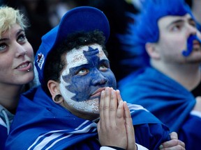 Toronto Maple Leafs fans react as they watch Game 7 of the first-round playoff series against the Boston Bruins on the big screen at Maple Leaf Square in Toronto May 13, 2013.   (Tyler Anderson/National Post)