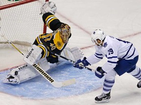 Bruins goalie Tuukka Rask, left, makes a pad save on a shot by Toronto's Joffrey Lupul during Game 7 of their first-round playoff series in Boston Monday, May 13, 2013. (AP Photo/Charles Krupa)