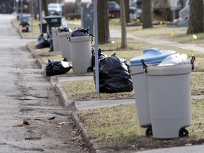 Garbage sits at the curb waiting to be picked up in Windsor on Feb. 8, 2012. (Windsor Star files)
