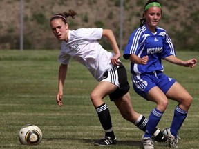 Belle River's Bella Habuda, left, cuts back against Villanova's Shelby Branton to set up a goal in the WECSSAA girls AAA soccer final at McHugh Park Tuesday May 21, 2013. (NICK BRANCACCIO/The Windsor Star)