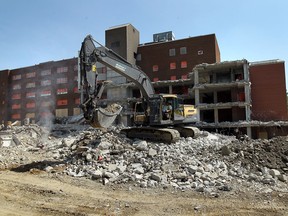 Demolition crews continue to tear down the former Grace Hospital in Windsor on Tuesday, May 21, 2013.                        (TYLER BROWNBRIDGE/The Windsor Star)