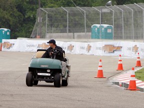 Crews works at a frantic pace to complete all the finishing touches for this weekends Detroit Grand Prix on Belle Isle in Detroit on Tuesday, May 28, 2013.                    (TYLER BROWNBRIDGE/The Windsor Star)