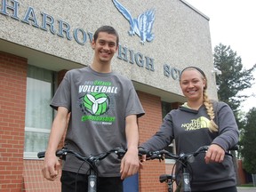 -Harrow District high school Grade 12 students Leighton Wollocombe, 17, left, and Cayla Wood, 18, prepare Friday, May 10 for the 2nd Annual Harrow Iron Hawk Duathalon, in support of W.E. Care for Kids and the Harrow Soaring Hawk Fund, to be held May 11 at the Harrow Soccer Complex. Julie Kotsis/The Windsor Star)