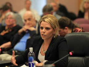 Jaclyn Miles speaks during a presentation to Windsor City Council regarding the Notice of Trespass Policy on May 27, 2013.  At left is Victoria Cross and Howard Pauley. (JASON KRYK/The Windsor Star)