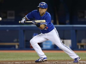 Toronto Munenori Kawasaki tries to lay down a bunt in the third inning against the Tampa Bay Rays May 22, 2013 at Rogers Centre in Toronto. (Tom Szczerbowski/Getty Images)