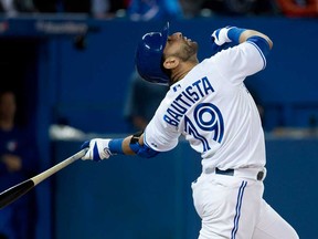 Blue Jays right fielder Jose Bautista looks up as he hits a pop up out against the Boston Red Sox during eighth inning  in Toronto on Thursday, May 2, 2013. THE CANADIAN PRESS/Nathan Denette