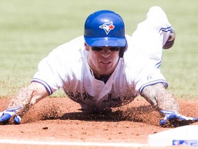Toronto's Brett Lawrie slides safely into third after hitting an RBI triple off Tampa Bay pitcher Jake Odorizzi during first inning AL baseball action in Toronto Monday May 20, 2013. The Jays beat the Rays 7-5. (THE CANADIAN PRESS/Chris Young)