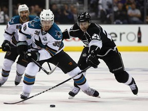 San Jose's Logan Couture, left, is pursued by Dustin Brown of the Los Angeles Kings in Game 7 of the Western Conference Semifinals  at Staples Center May 28, 2013 in Los Angeles. (Jeff Gross/Getty Images)