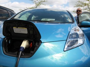 A Nissan Leaf electric car charges up at the Windsor Crossing Outlet in Windsor on Monday, May 13, 2013.                            (TYLER BROWNBRIDGE/The Windsor Star)