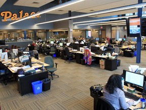 The Star newsroom in its new home at 300 Ouellette. Unlike the former home on Ferry Street, all departments sit on one floor. The restored sign from the old Palace cinemas has a place of honour above the newsroom. (JASON KRYK / The Windsor Star)
