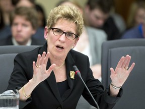 Premier Kathleen Wynne's first budget fails to deal  with Ontario's fiscal  challenges. (THE CANADIAN PRESS/Frank Gunn)