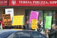 Local physiotherapy workers protest Friday, May 24, 2013, outside of the office of MPP Teresa Piruzza's constituency office in Windsor, Ont. (DAN JANISSE/The Windsor Star)