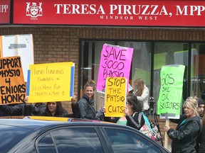 Local physiotherapy workers protest Friday, May 24, 2013, outside of the office of MPP Teresa Piruzza's constituency office in Windsor, Ont. (DAN JANISSE/The Windsor Star)