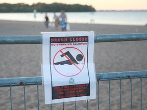 A sign by the health unit prohibits swimming at Sandpoint Beach in this 2010 file photo. (Jason Kryk / The Windsor Star)