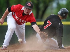 Tyson Way of the Windsor Selects 18's slides into second base on a wild pitch while Team Ontario's Glenn Reeves, left, tries to block the ball at Mic Mac Park, Sunday, May 12, 2013. (DAX MELMER/The Windsor Star)