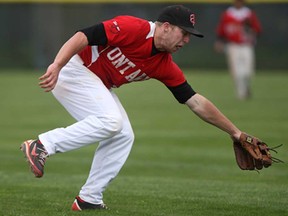 Team Ontario second baseman Gleen Reeves lets a ball get by him for a base hit during the first game in a doubleheader against the Windsor Selects 18's at Mic Mac Park, Sunday, May 12, 2013. (DAX MELMER/The Windsor Star)