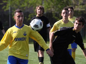 Kennedy Wassam Charaf, left, battles with General Amherst's Alex Popel in senior boys playoff soccer action at Windsor Stadium May 17, 2013. The Clippers won 5-1. (NICK BRANCACCIO/The Windsor Star)