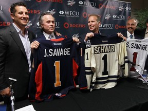 Bob Boughner, John Savage, Brian Schwab, Stephen Savage and Warren Rychel (left to right) take part in a new Spitfires ownership announcement at the WFCU Centre in Windsor on Thursday, May 9, 2013. Cypher Systems Group Inc. will join Boughner and Rychel as owners of the Windsor Spitfires. (TYLER BROWNBRIDGE/The Windsor Star)