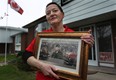 Theresa Charbonneau, holds a photo May 3, 2011, of her son soldier Cpl. Andrew Grenon who was killed in Afghanistan. Charbonneau was reacting to the recent death of Osama bin Laden at the hands of U.S. special forces. (DAN JANISSE/The Windsor Star)