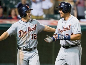 Detroit's Andy Dirks, left, celebrates with Miguel Cabrera after both scored on a home run hit by Cabrera during the eighth inning against the Indians at Progressive Field May 22, 2013 in Cleveland. (Jason Miller/Getty Images)