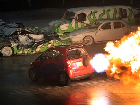 A jet powered Smart car spews fire across the arena during the Toughest Monster Truck Tour at the WFCU Centre  on May 24, 2013.   (Jason Kryk/ The Windsor Star)